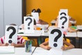 School kids covering their face with question mark sign Royalty Free Stock Photo