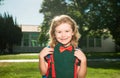 School, kids education concept. Child with rucksacks standing in the school park. Pupil with backpacks outdoors.