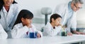 School kids, experiment and class for science, learning or teacher with info, guide and knowledge in lab. Children, boy Royalty Free Stock Photo