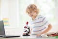 School kids with microscope. Science class Royalty Free Stock Photo