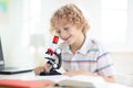 School kids with microscope. Science class Royalty Free Stock Photo