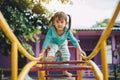 School kids play and learn in the playgound. Physical activity like climbing are good for develop movement and muscle in children