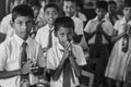 School kids pray before they eat food