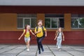 School kids run from school. Classmates with backpacks. Back to school Royalty Free Stock Photo