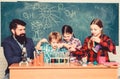 School kids scientist studying science. back to school. happy children teacher. Little kids learning chemistry in school