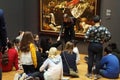 School kids study a painting in the Rijks Museum