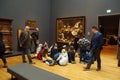 School kids study a painting in the Rijks Museum