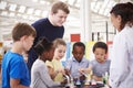 School kids taking part in a science experiment, close up