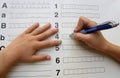 School kids writening alphabet