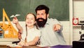 School learners leisure. Creating a community of learners. Teacher and schoolgirl. Man bearded pedagogue and pupil Royalty Free Stock Photo