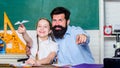 School learners leisure. Creating a community of learners. Teacher and schoolgirl. Man bearded pedagogue and pupil Royalty Free Stock Photo
