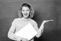 School lecturer with notebook. Woman cheerful teacher hold laptop stand near chalkboard. School education concept