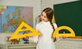 School lesson items. High school student learning geometry in class. measure angles in degrees. Small child girl use