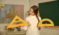 School lesson items. High school student learning geometry in class. measure angles in degrees. Small child girl use