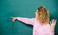 School lesson knowledge. Remember this. Strict woman teacher pointing at chalkboard. Informing kids. School rules Royalty Free Stock Photo