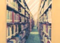 School library or study class room, education blur interior background with blurry view of books on bookshelves in classroom aisle Royalty Free Stock Photo