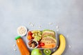 School lunch box with vegetables, fruits and sandwich on kitchen table top view. Royalty Free Stock Photo