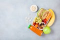 School lunch box with vegetables, fruits and sandwich on table top view. Royalty Free Stock Photo