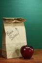 School Lunch Sack Sitting on Teacher Desk Royalty Free Stock Photo