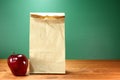 School Lunch Sack Sitting on Teacher Desk Royalty Free Stock Photo