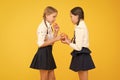 School lunch. Vitamin nutrition. Fresh fruit school. Girls kids school uniform drinking orange fruit fresh juice Royalty Free Stock Photo