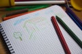A school notebook where a child has drawn a simple house Royalty Free Stock Photo