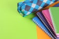 School notebooks of different colors and a pencil case on a bright orange and green background. School supplies. Royalty Free Stock Photo