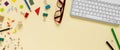 School and office supplies border with keyboard on beige paper background. Multicolored pencils, paints, plasticine, abacus, Royalty Free Stock Photo