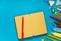 School office supplies on a desk with copy space. Back to school concept. School supplies on blue background. Back 2 school Royalty Free Stock Photo