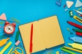 School office supplies on a desk with copy space. Back to school concept. School supplies on blue background. Back 2 school Royalty Free Stock Photo