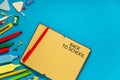 School office supplies on a desk with copy space. Back to school concept. School supplies on blue background. Back 2 school Royalty Free Stock Photo