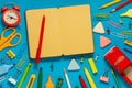 School office supplies on a desk with copy space. Back to school concept. School supplies on blue background. Back 2 school Royalty Free Stock Photo