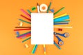 School office supplies on orange background Royalty Free Stock Photo