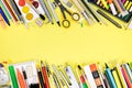 School and office supplies for studies on yellow background Royalty Free Stock Photo