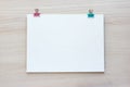 School office supplies on wooden background. Back to school concept. White board with hands for copy space. Top view Royalty Free Stock Photo