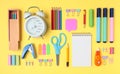 School and office supplies on yellow background, mock-up top view Royalty Free Stock Photo