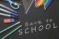School and Office Utensils on a Blackboard Surface Royalty Free Stock Photo