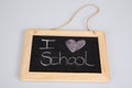 School old retro blackboard and white chalk text i love on grey background Royalty Free Stock Photo