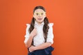 School party concept. What does it mean being smart. Little smart schoolgirl on orange background. Child smart look