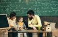 School psychologist concept. School psychologists work with child in class. Little boy listen to school psychologists Royalty Free Stock Photo