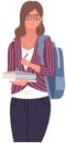 School pupil or college student standing with books. Portrait of smiling schoolgirl with backpack