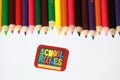 School rules character ,School supplies colored pencils in a row, isolated Royalty Free Stock Photo