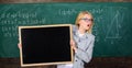 School schedule and extra classes. Teacher woman hold blackboard blank advertisement copy space. School information for