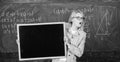 School schedule and extra classes. Teacher woman hold blackboard blank advertisement copy space. School information for