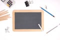 School set: black chalkboard and school supplies isolated on white background with copy space for your text Royalty Free Stock Photo