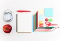 School set with notebooks, pencils, brush, scissors and apple on white background Royalty Free Stock Photo