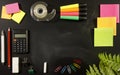 School stationary supplies on black chalkboard background with copy space ready for graphic design, school education learning Royalty Free Stock Photo