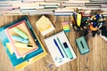 School stationery accessories - notebook, copybook stack with plastic holder pencils, pens, markers, paper clips, stickers,
