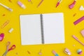 School stationery and notebook on a yellow background. Top view with copy space. Flat lay. Back to school concept Royalty Free Stock Photo