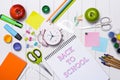 School stationery or office supplies on wood background. Royalty Free Stock Photo